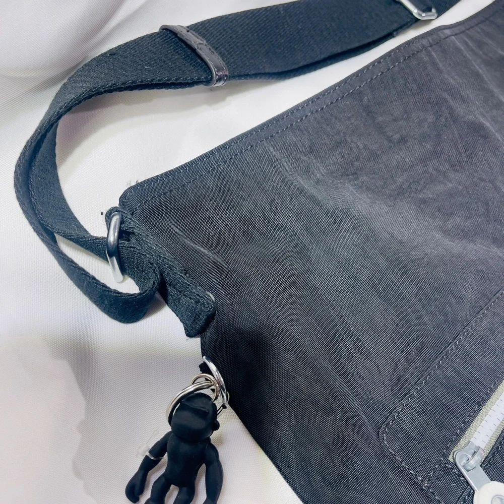 Kipling Black and Tan Messenger Bag with Multiple Compartments